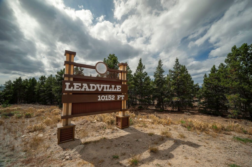 Leadville elevation sign with cloudy sky.